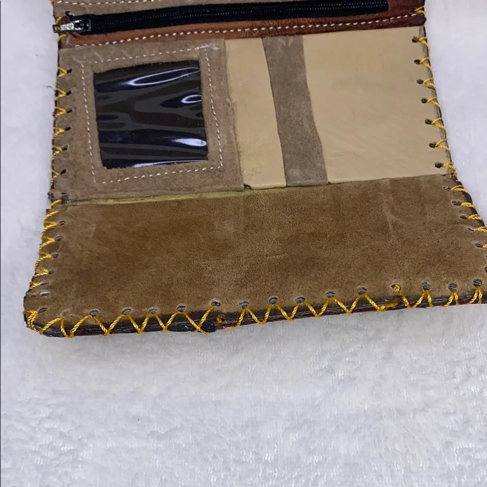 Brown and Yellow Wallet with Decorative Medallion